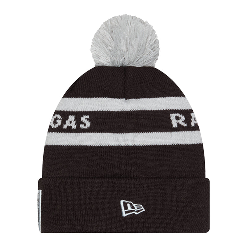 Black knit beanie with gray pom, white stripe band, New Era tag patch