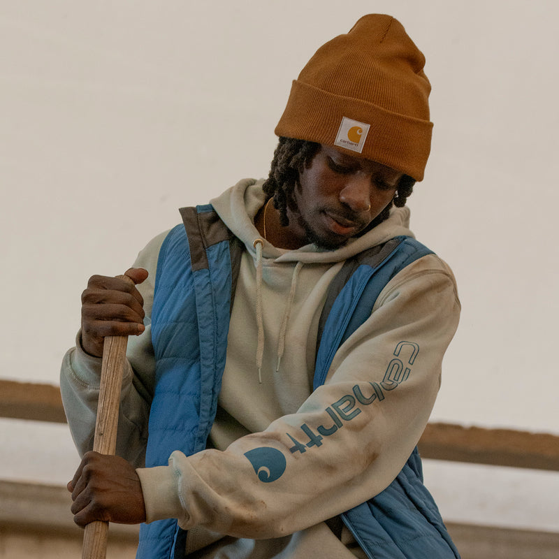 Carhartt brown knit beanie with folded cuff and Carhartt logo patch.