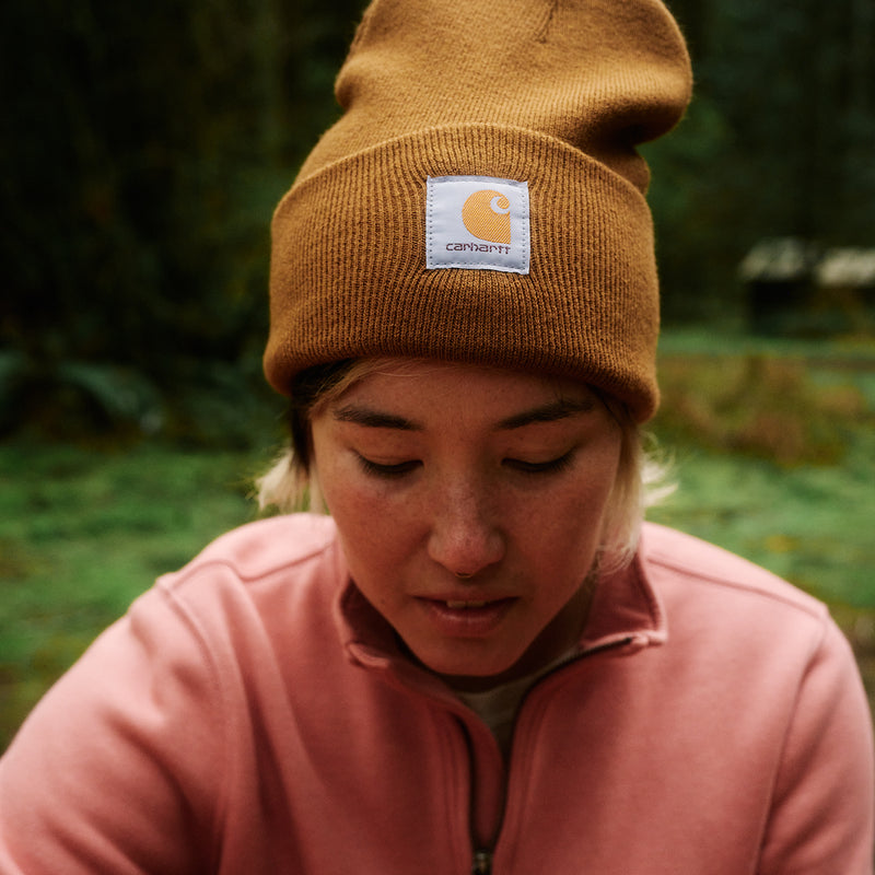 Carhartt brown knit beanie with folded cuff and Carhartt logo patch.