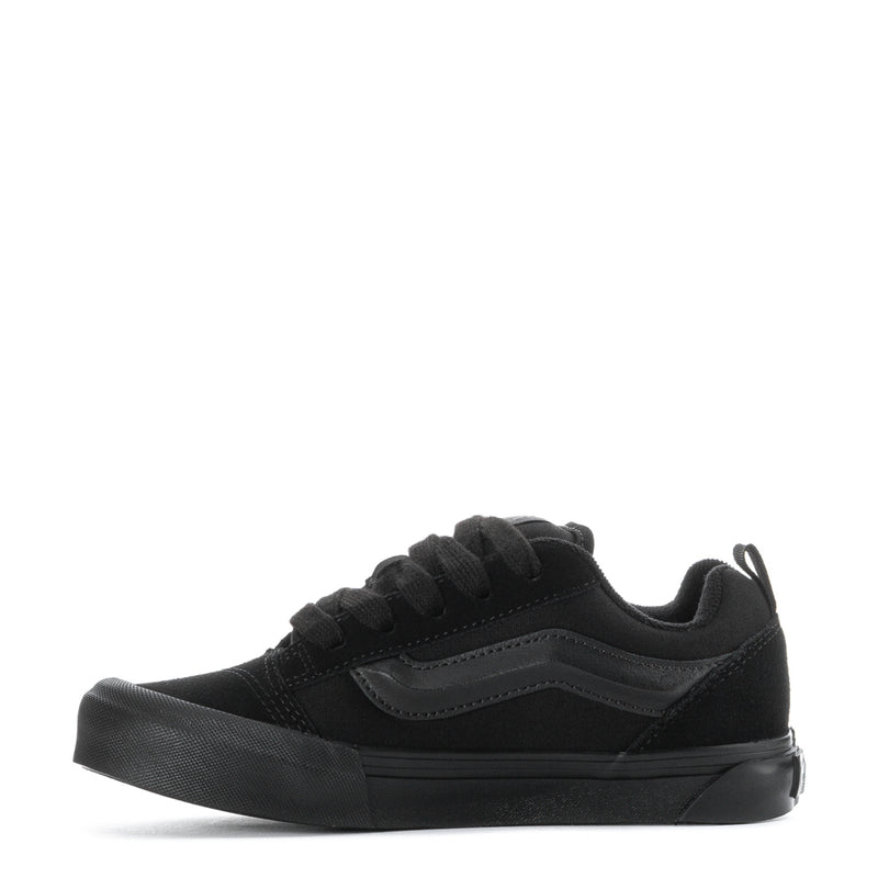 Kids triple-black lace-up sneakers, side angle with textured midsole