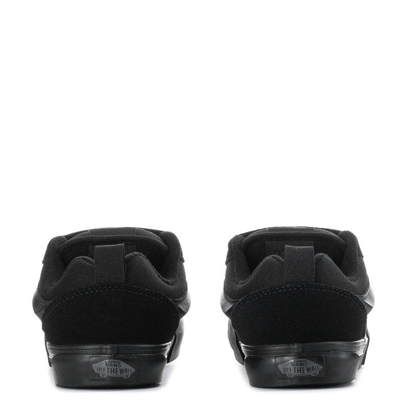 Kids triple-black sneakers, rear view with heel tab and rubber sole