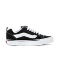 Men's Knu Skool sneakers, black with white side stripe and white rubber sole.