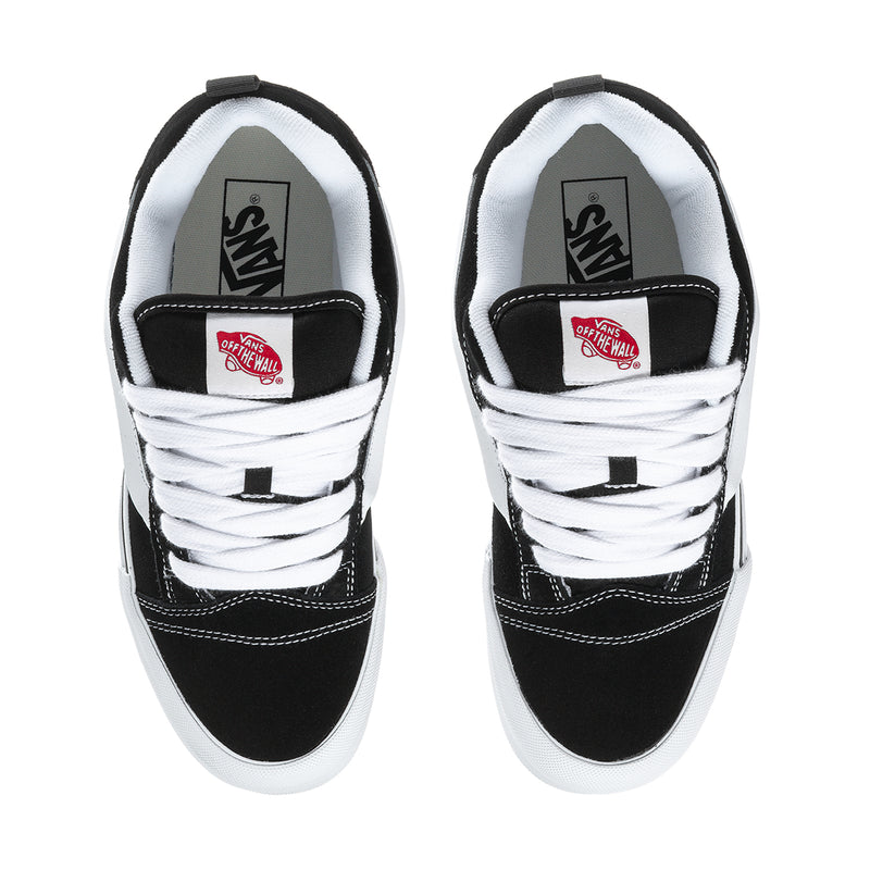 Men's Knu Skool sneakers, black-and-white lace-up with tongue logo patch.