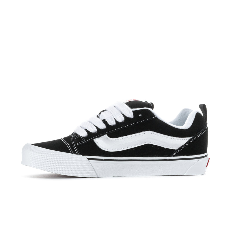 Men's Knu Skool low-top sneakers, black with white swoosh and striped side panel.