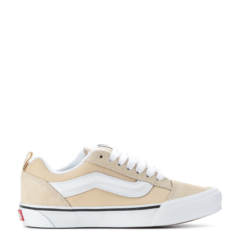 Beige and white low-top women's sneakers with white laces and light blue side stripe