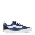 Youth navy-and-white sneakers with white laces and low-profile sole