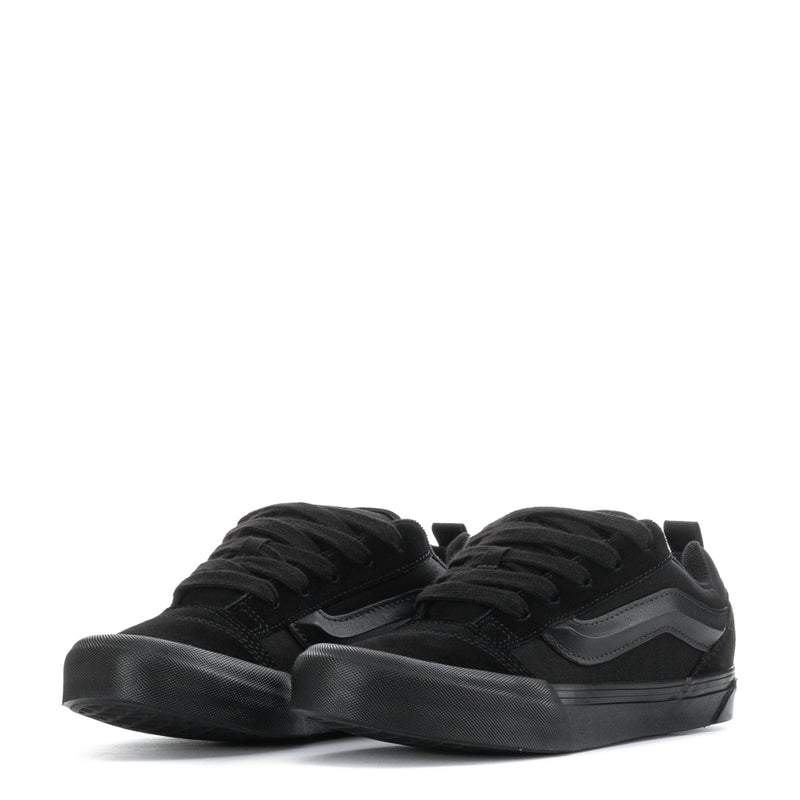 Youth low-top sneakers in black, lace-up top view with cushioned low profile sole