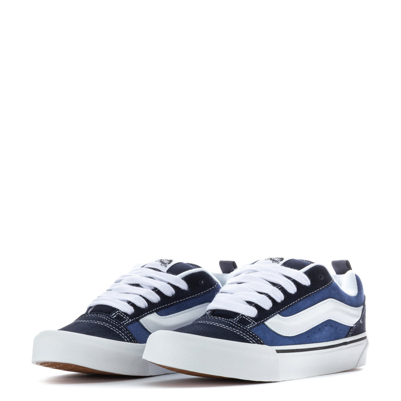 Youth navy-and-white sneakers, pair view with white laces and white sole