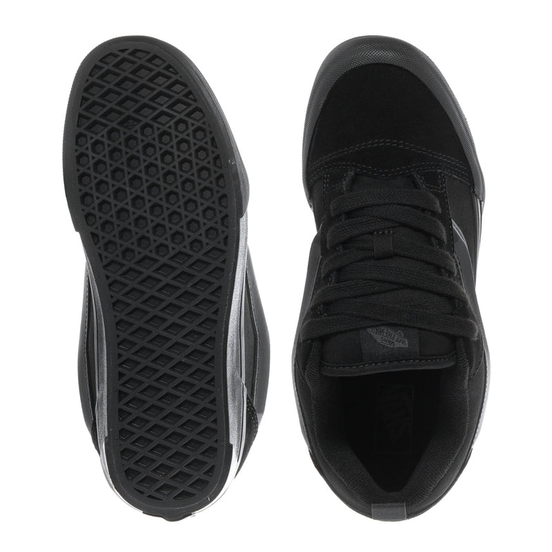Black youth sneakers outsole and toe view, textured rubber tread and lace collar