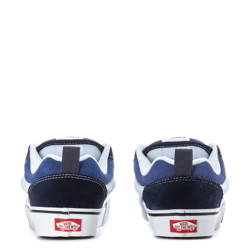 Youth navy-and-white sneakers with heel tab, back view and white rubber sole