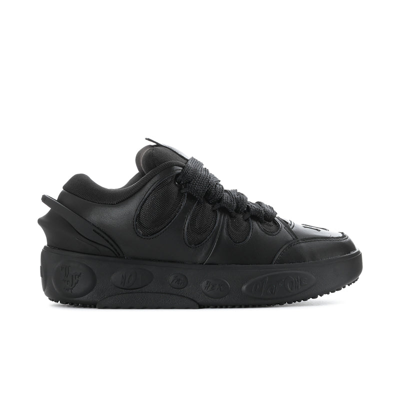 Black low-top sneakers with lace-up front and textured rubber sole