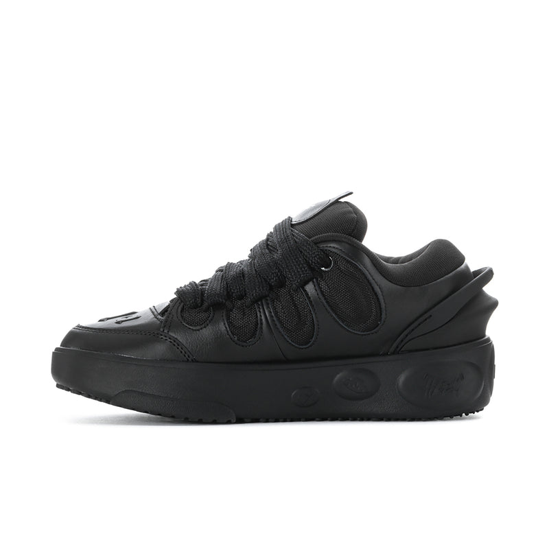 Black lace-up low-top sneakers with lace overlay and side logo
