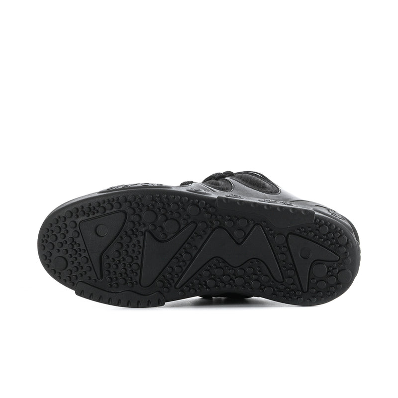 Black rubber outsole with multidirectional tread and embossed traction pattern