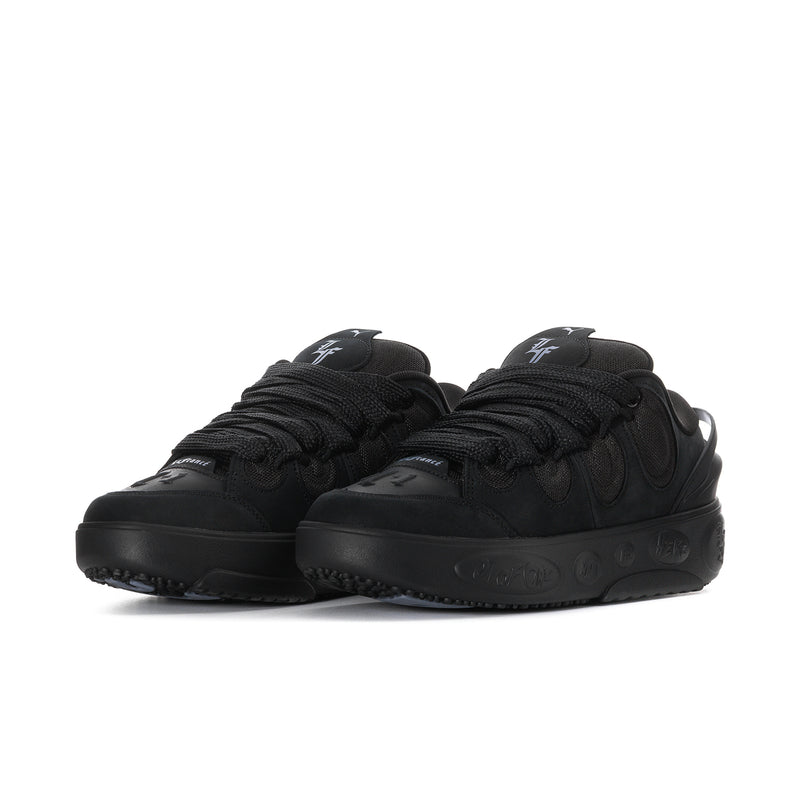 Black lace-up skate sneakers with thick rubber outsole and side PUMA logos
