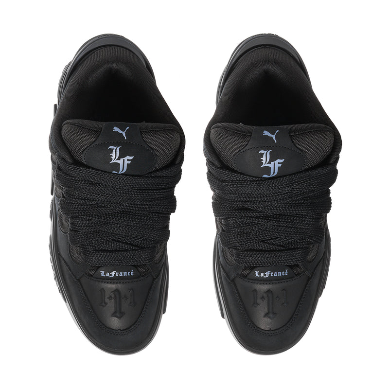 Black skate sneakers, top view with La France heel patch and lace-up collar