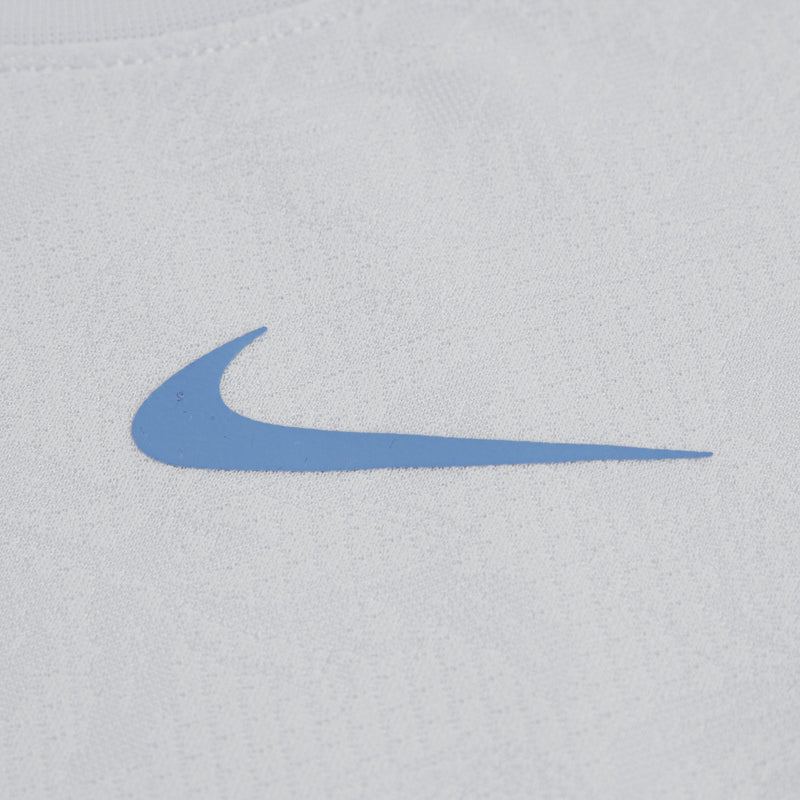 Gray T-shirt with blue swoosh logo print