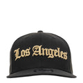 Black baseball cap with gold Los Angeles script front logo