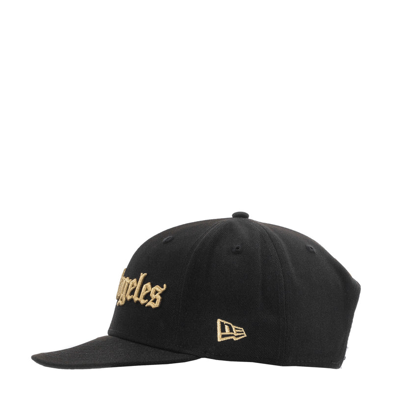 Black baseball cap with gold Los Angeles side lettering