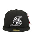 Black snapback cap with white Lakers logo on the front panel