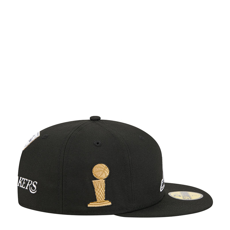 Black snapback cap with gold trophy logo on the front panel
