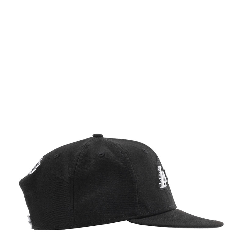 Black cap with white side embroidery and curved brim