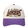 White and purple Los Angeles Lakers snapback cap with front LAKERS logo patch