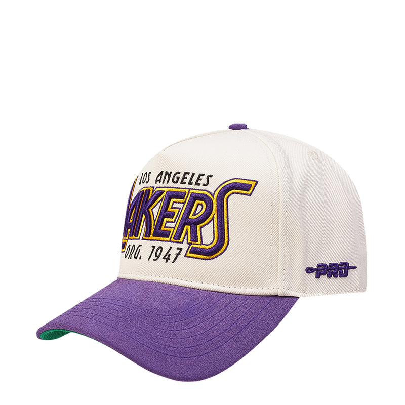 White and purple Lakers snapback cap with embroidered LAKERS logo on front