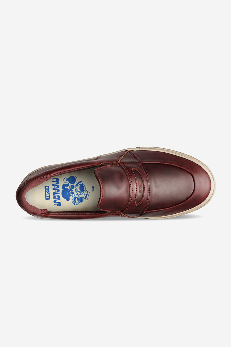 Top view of oxblood Liaizon skate shoe with a strap across the vamp and a cream sole.