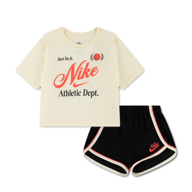 Kids cream T-shirt and black athletic shorts set with red Nike logo