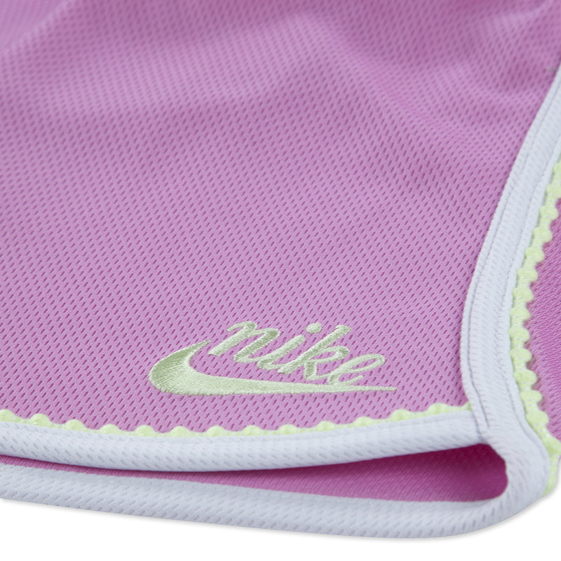 Light magenta shorts hem with Nike logo embroidery and contrast piping