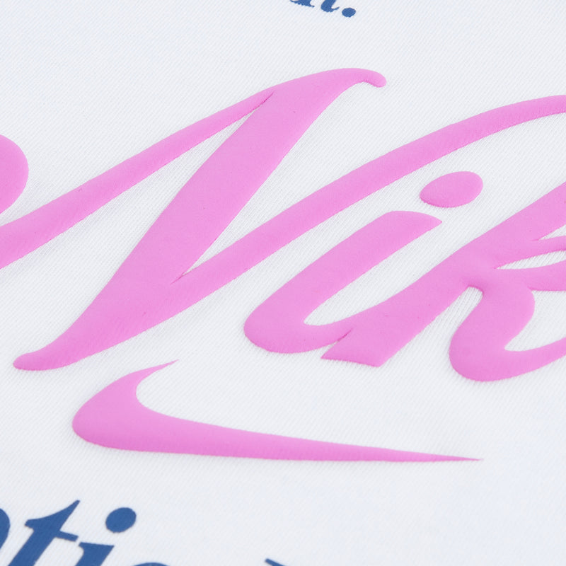 White T-shirt with pink script graphic and dark blue text detail
