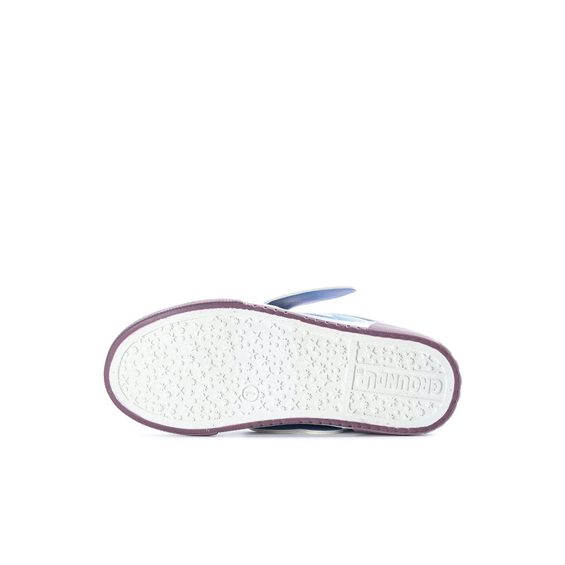 Kids sneaker outsole view: white tread with purple edge and underside branding