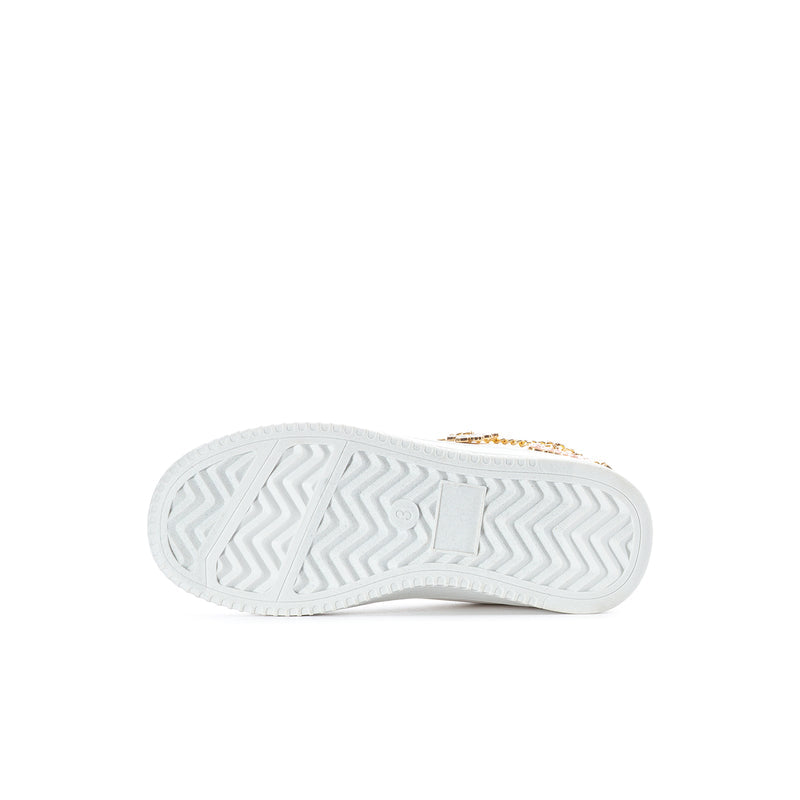 Kids white court sneaker outsole with zigzag rubber tread and gold heel accent