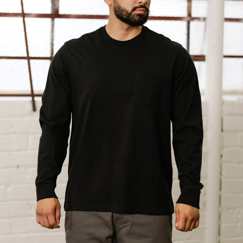 Men's black long-sleeve crewneck work shirt, worn by model