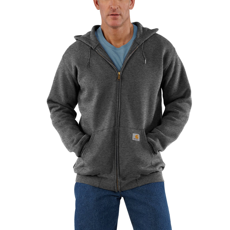Heather gray zip hoodie with hood, drawstrings, and front logo patch; worn with jeans