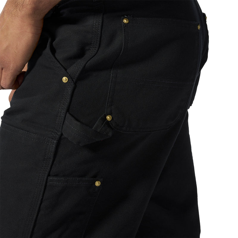 Black work dungaree pants close-up of flap pocket with gold buttons