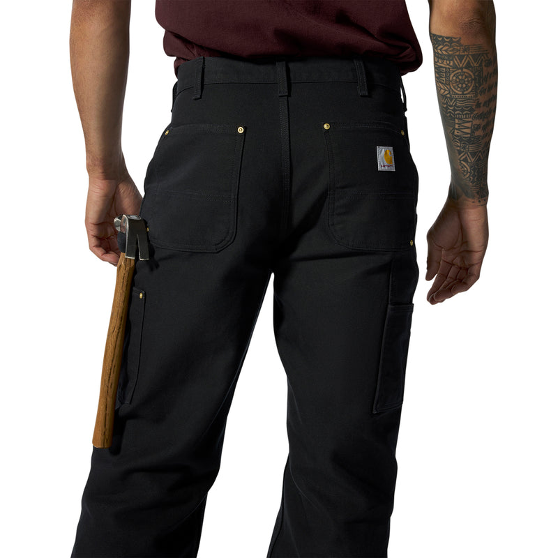 Black work dungaree pants back view with cargo pockets, belt loops, and side tool loop