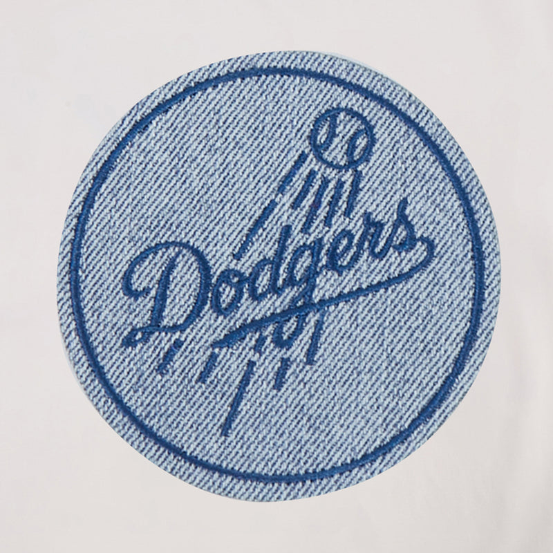 Round embroidered Dodgers patch in blue denim texture on eggshell T-shirt