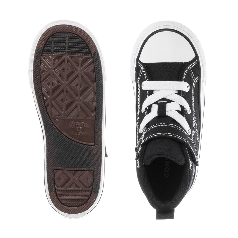 Toddler sneaker soles with black upper; white laces and stitching visible on top.