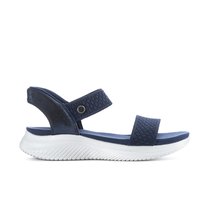 Navy slip-in knit sandals with padded straps and white cushioned sole