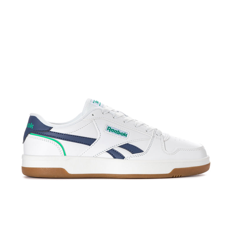Women's white sneaker with navy and green accents, gum sole