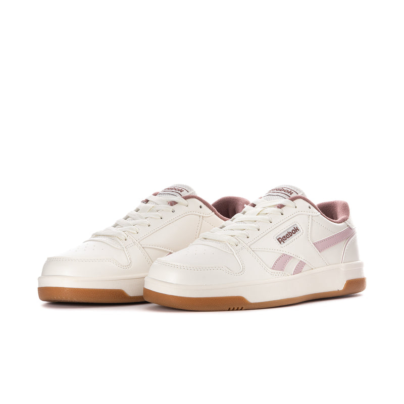 Women’s Reebok Match Prime V2 sneakers, white upper with mauve/pink overlays and tan sole.