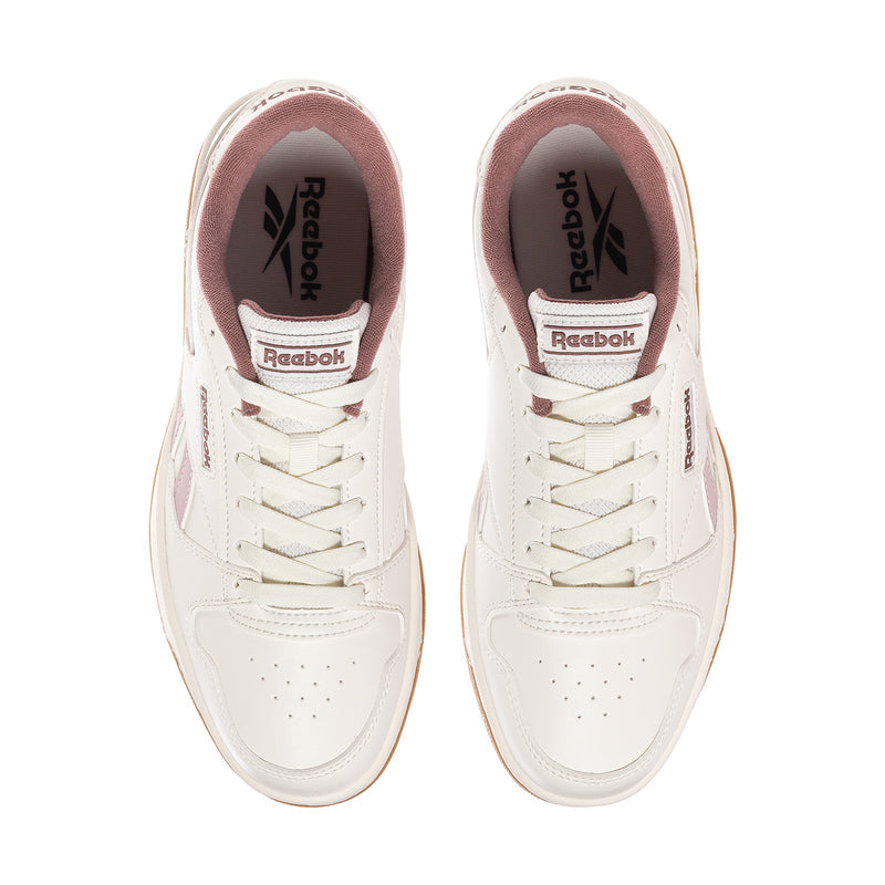 Women’s Reebok Match Prime V2 sneakers, white with mauve lining and Reebok logo on tongue.