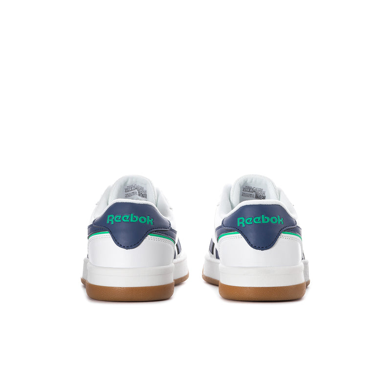 Women's white sneaker heel, navy collar with green Reebok logo, gum sole