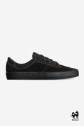 Melbek skate shoe in black suede with tan stitching and a textured black outsole, side view