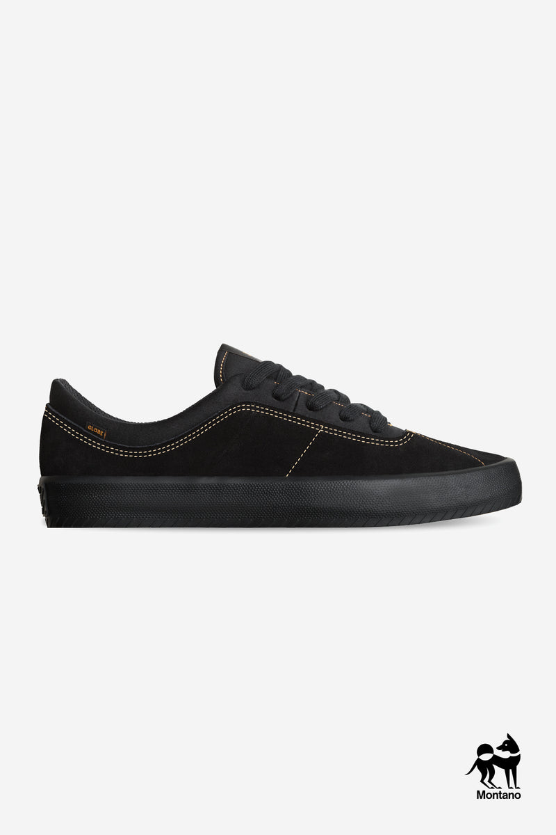Melbek skate shoe in black suede with tan stitching and a textured black outsole, side view