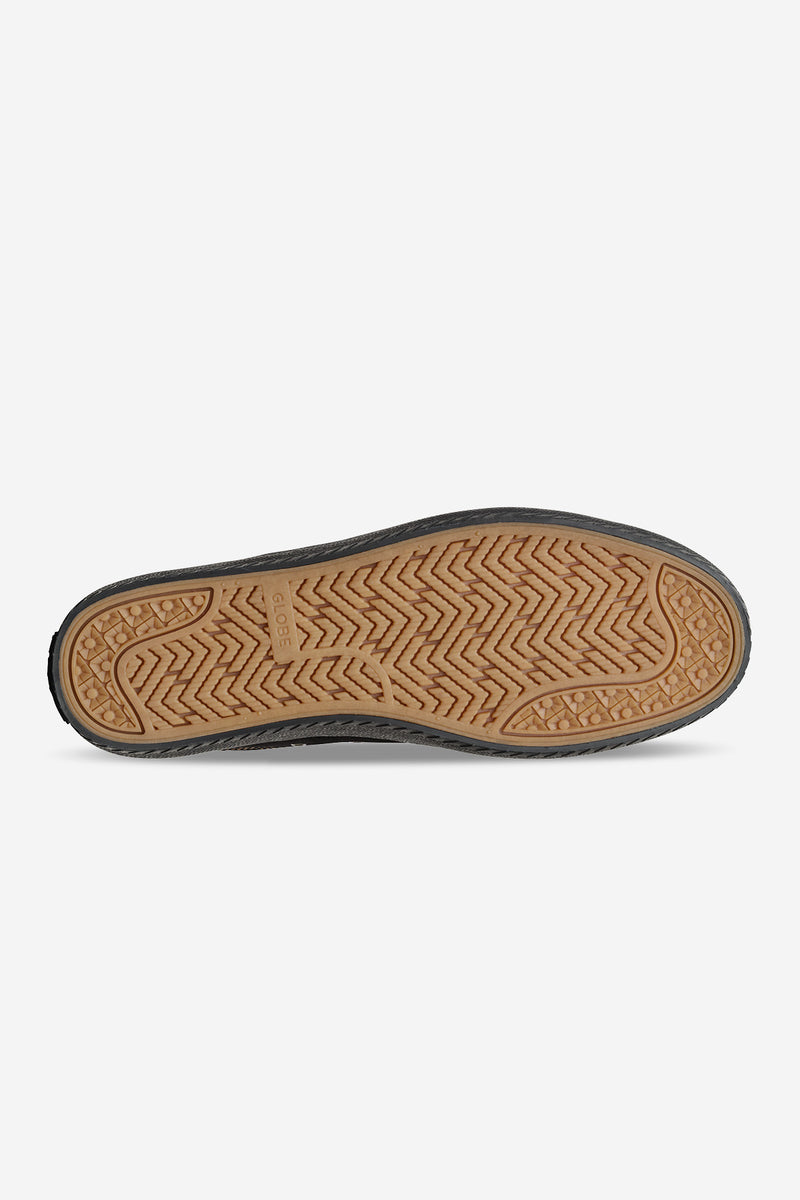 Bottom view of Melbek black suede skate shoe showing tan gum outsole and herringbone tread pattern