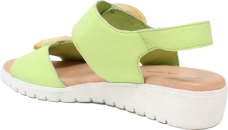 Green sandal with a white sole on a white background