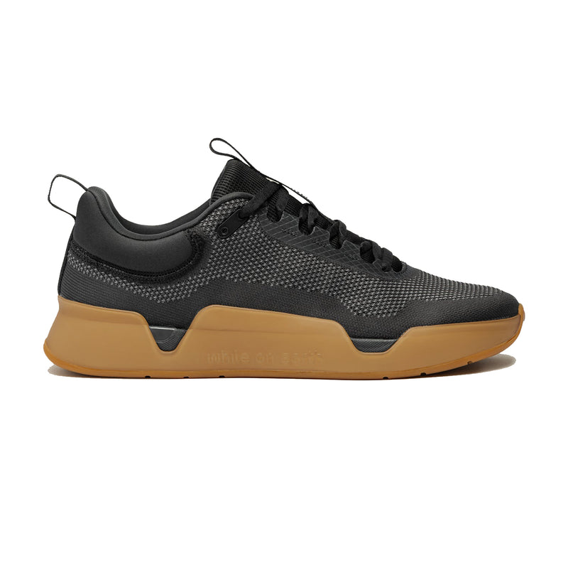 While On Earth Move trainer gym shoe in black and gum