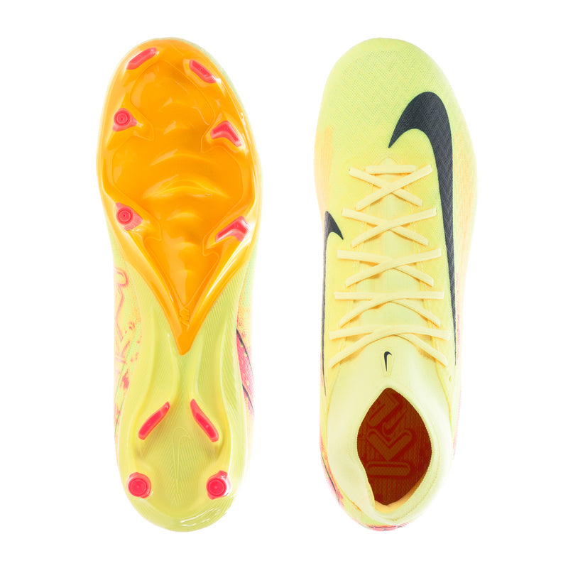Yellow soccer cleats outsole view with orange studs and red forefoot accents